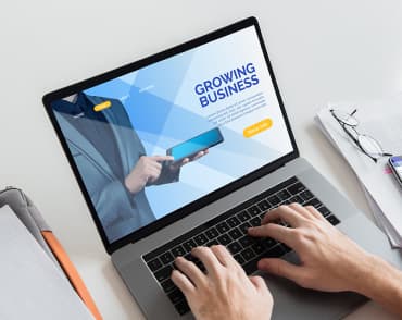 Laptop with open website Crowing Business